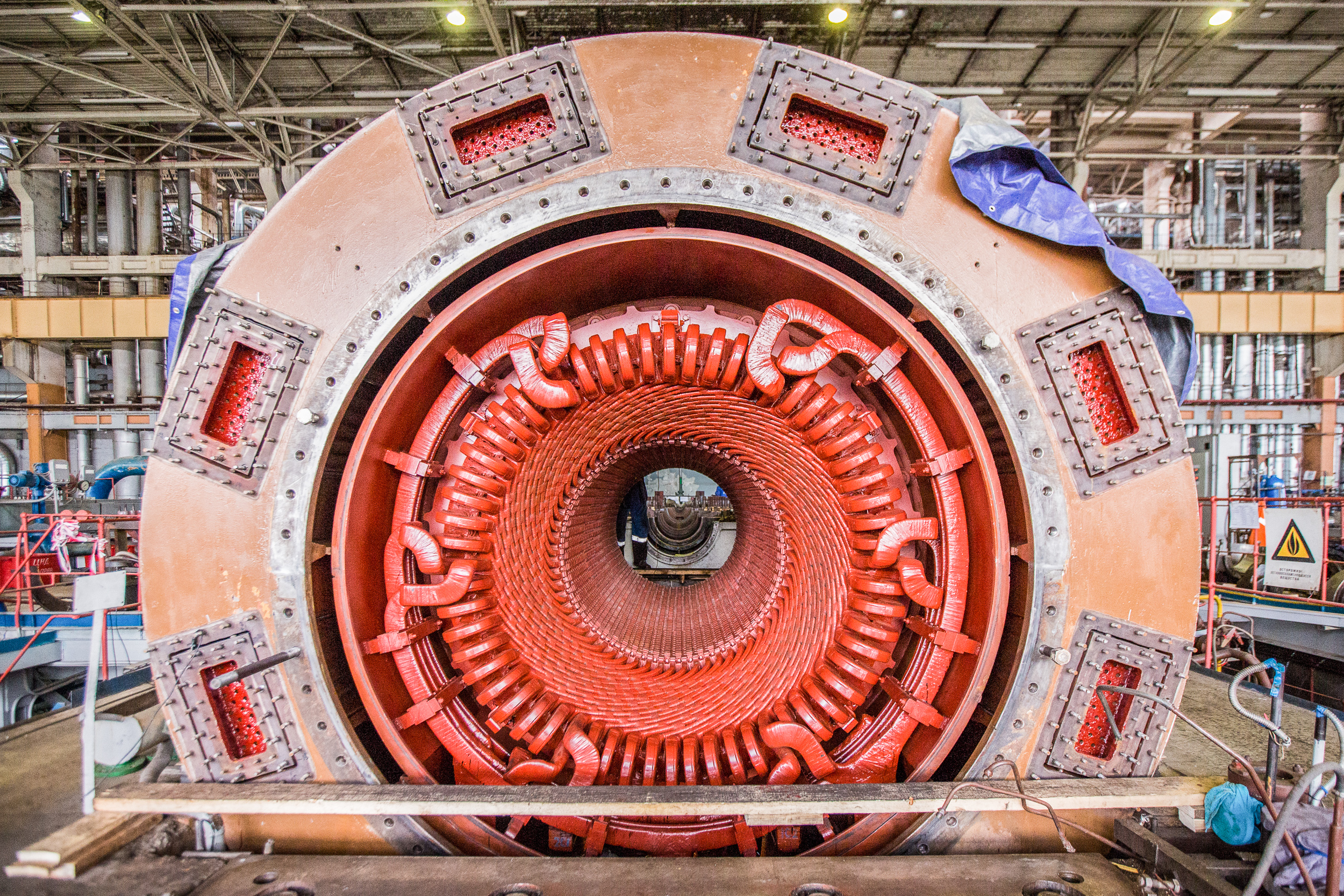 The painstaking work goes on the generator stator windings